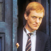 Turlough looking out of the Tardis