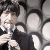 The Second Doctor playing the recorder.