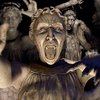 A grimacing weeping angel with others behind.