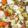 Close up of a rice dish with chickpeas and vegetables.