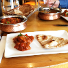 Fancily presented curry and naan bread.