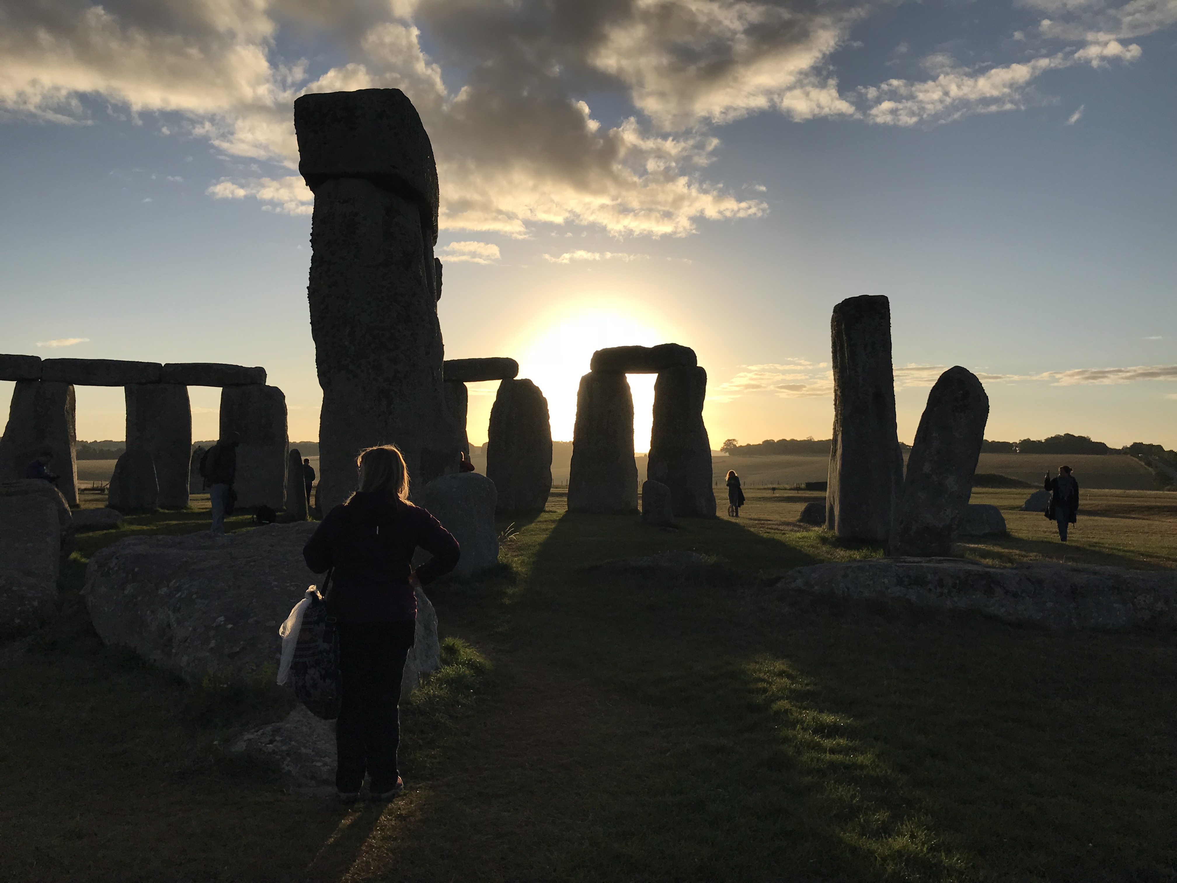 Stonehenge at dawn.  The stones as silhouettes against the sunrise.