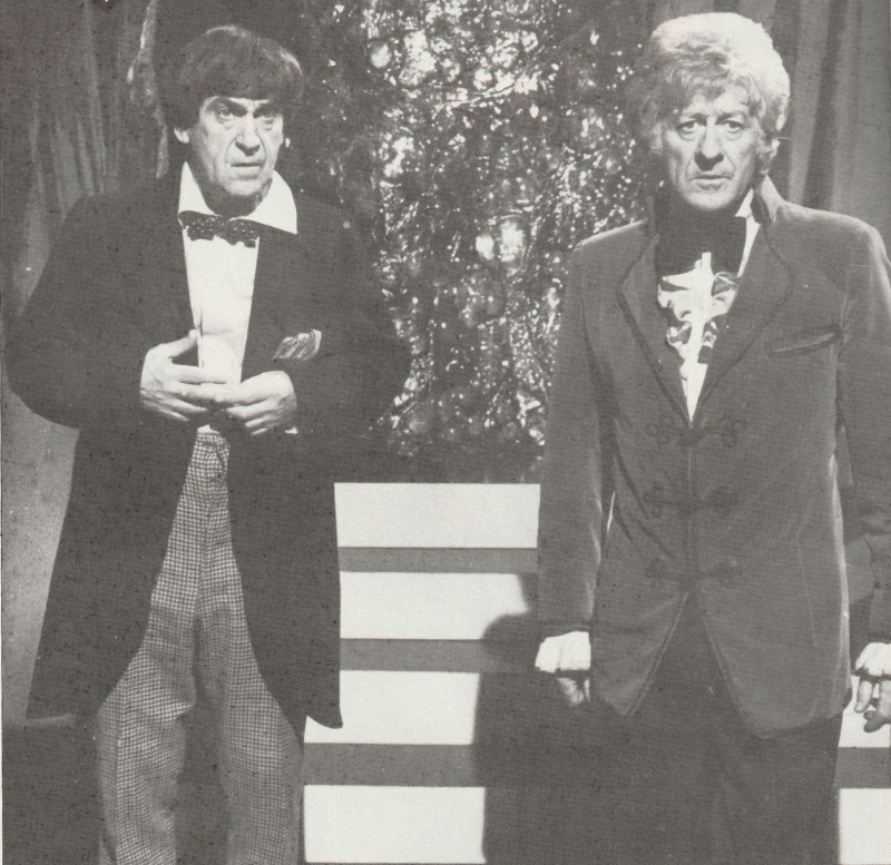 Black and White photo of Patrick Troughton and Jon Pertwee standing next to each other in The Three Doctors.